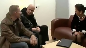 A Mature German Woman With Unshaven Skin Enjoys Having Sex With Two Men In An Office Setting